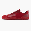 Red athletic shoe with red sole on a white background