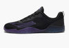 Black and purple athletic shoe on a white background